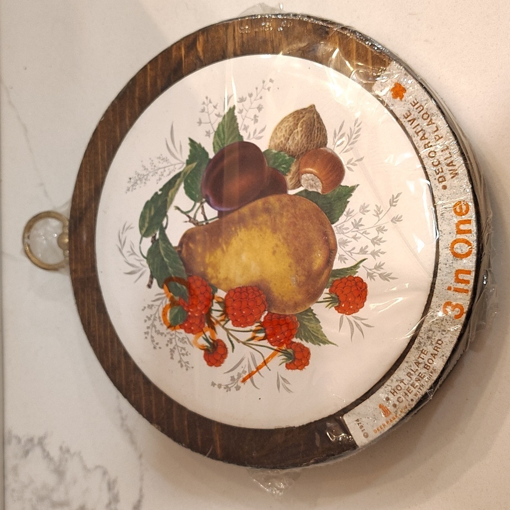 1974 3 in one hot plate cheese board & wall plaque with knife and hanger.